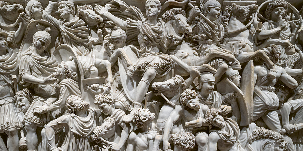 Detail of the third-century Great Ludovisi Battle Sarcophagus, with densely packed figures of Romans and barbarians engaged in combat, surrounded by horses, shields, and weapons. Detail of the third-century Great Ludovisi Battle Sarcophagus, with densely packed figures of Romans and barbarians engaged in combat, surrounded by horses, shields, and weapons.