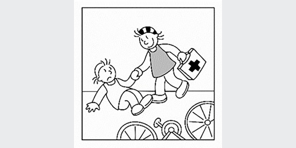 One child helps another get up after falling off his bike.