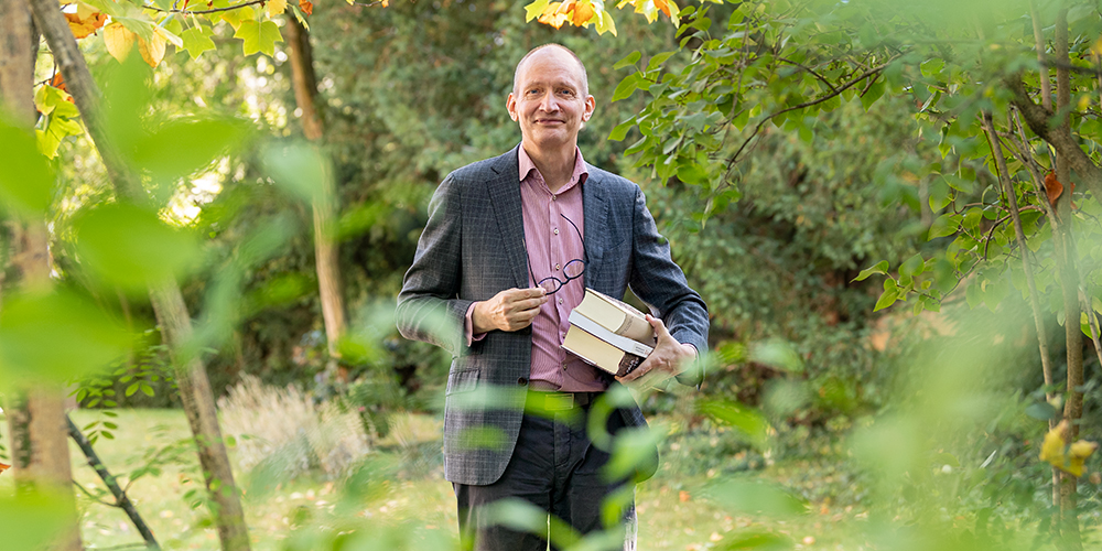 Abrahams in the woods holding books