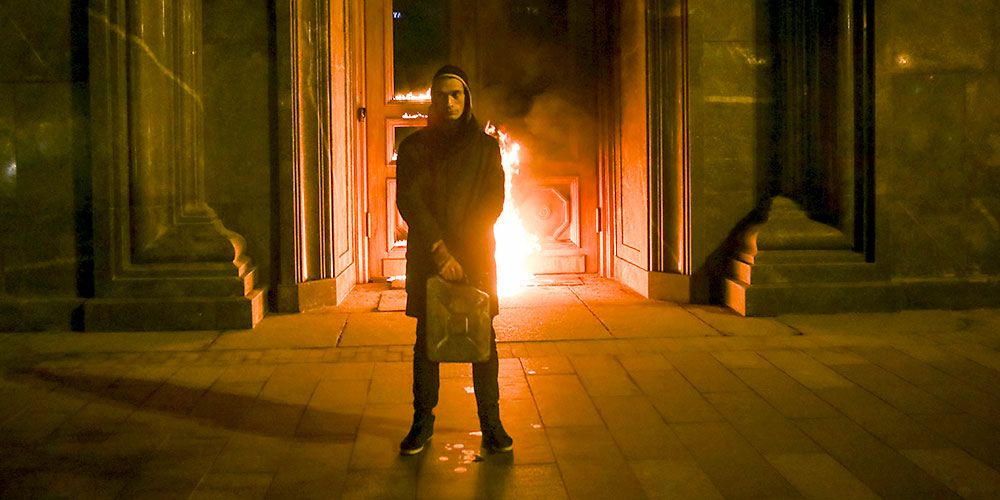 Artist Pyotr Pavlensky poses after setting fire to the doors of the headquarters of the FSB security service in central Moscow. (Image: ciconia ciconia Verlag, Berlin)