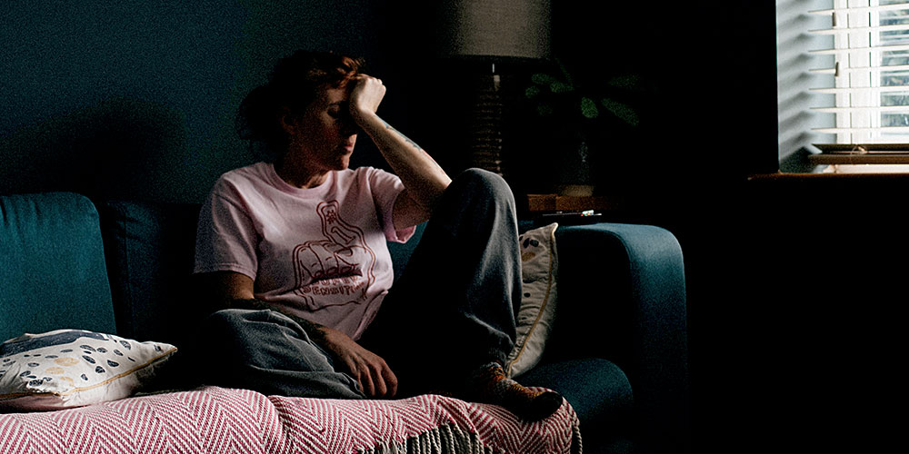 Exhausted woman on a couch