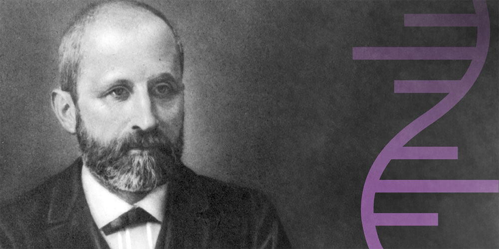 Historical black-and-white portrait of a man with a receding hairline and full beard, wearing a suit and bow tie. A stylized purple DNA double helix is shown on the right. Historical black-and-white portrait of a man with a receding hairline and full beard, wearing a suit and bow tie. A stylized purple DNA double helix is shown on the right.